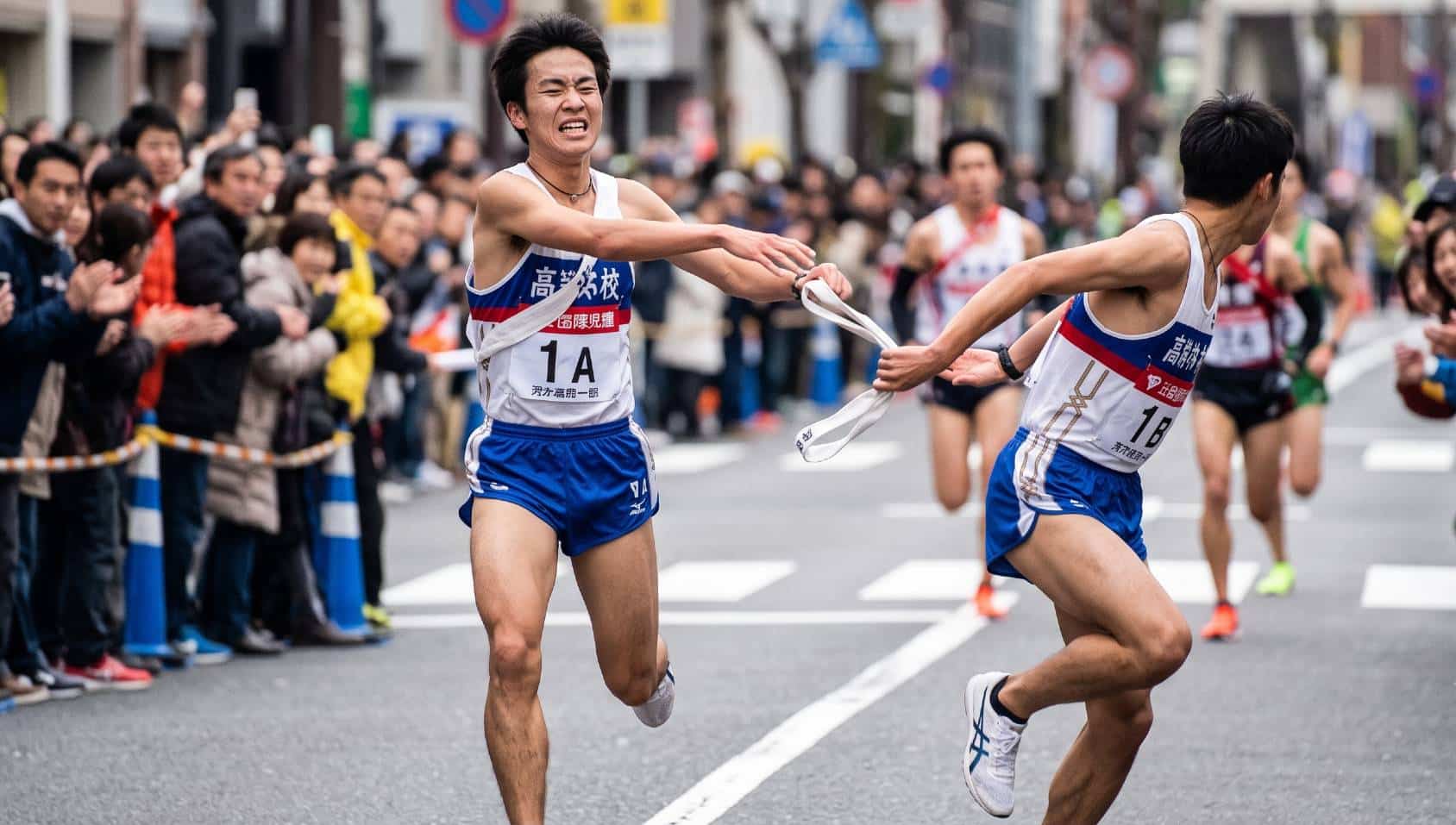 Japanese high school runners competing in an ekiden road relay