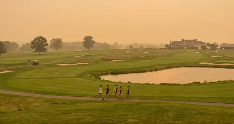 cross country runners training in wildfire smoke