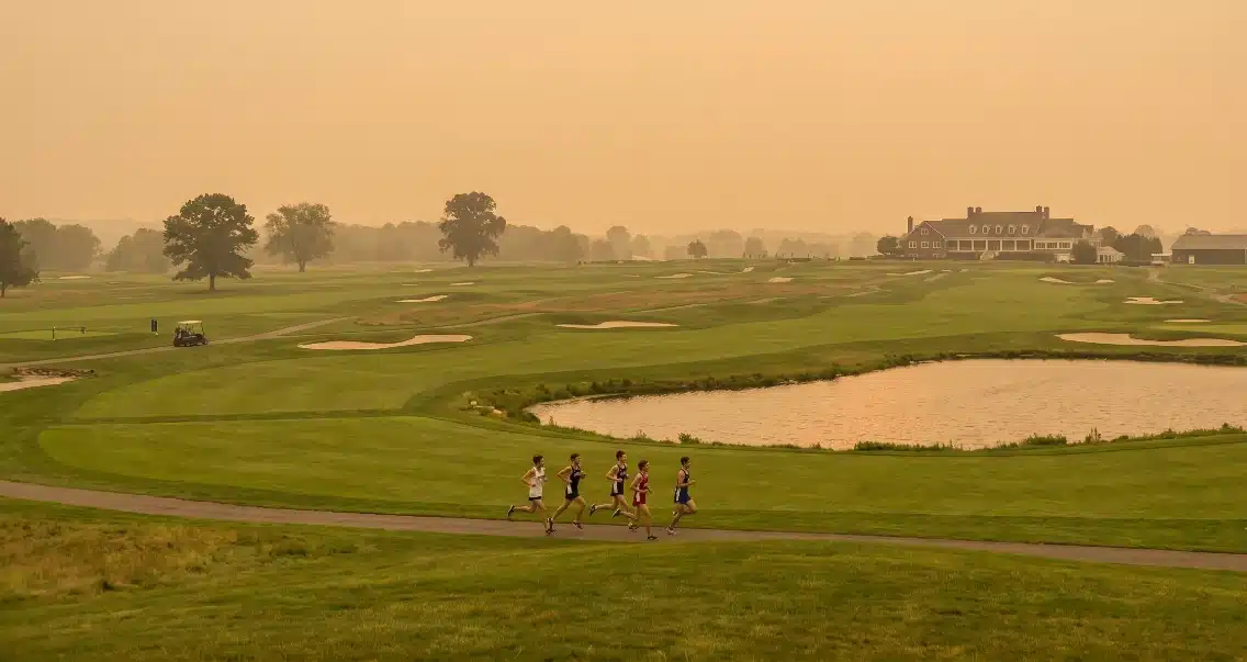 cross country runners training in wildfire smoke